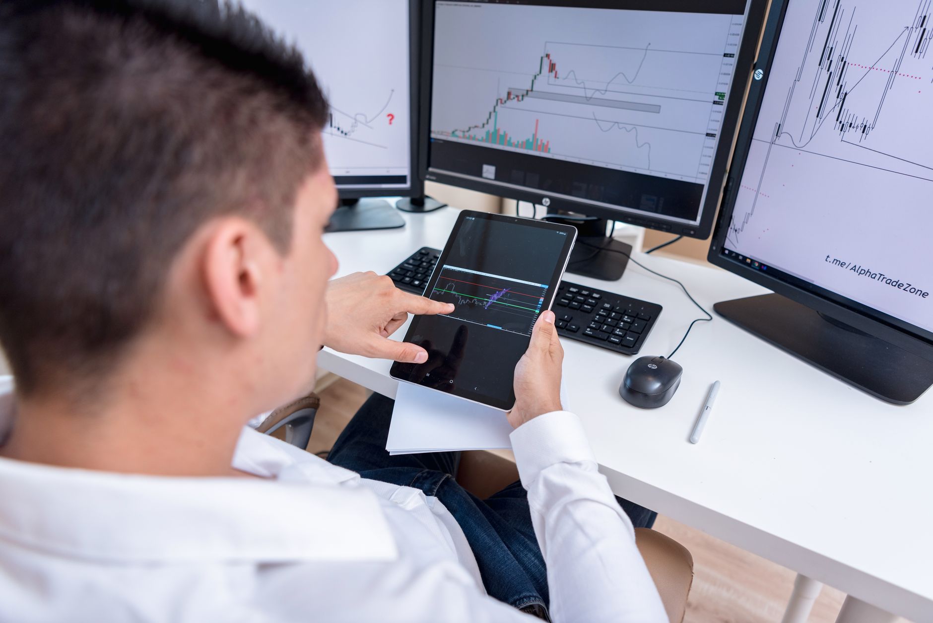 Investor reviewing bond market analysis at a desk with financial data