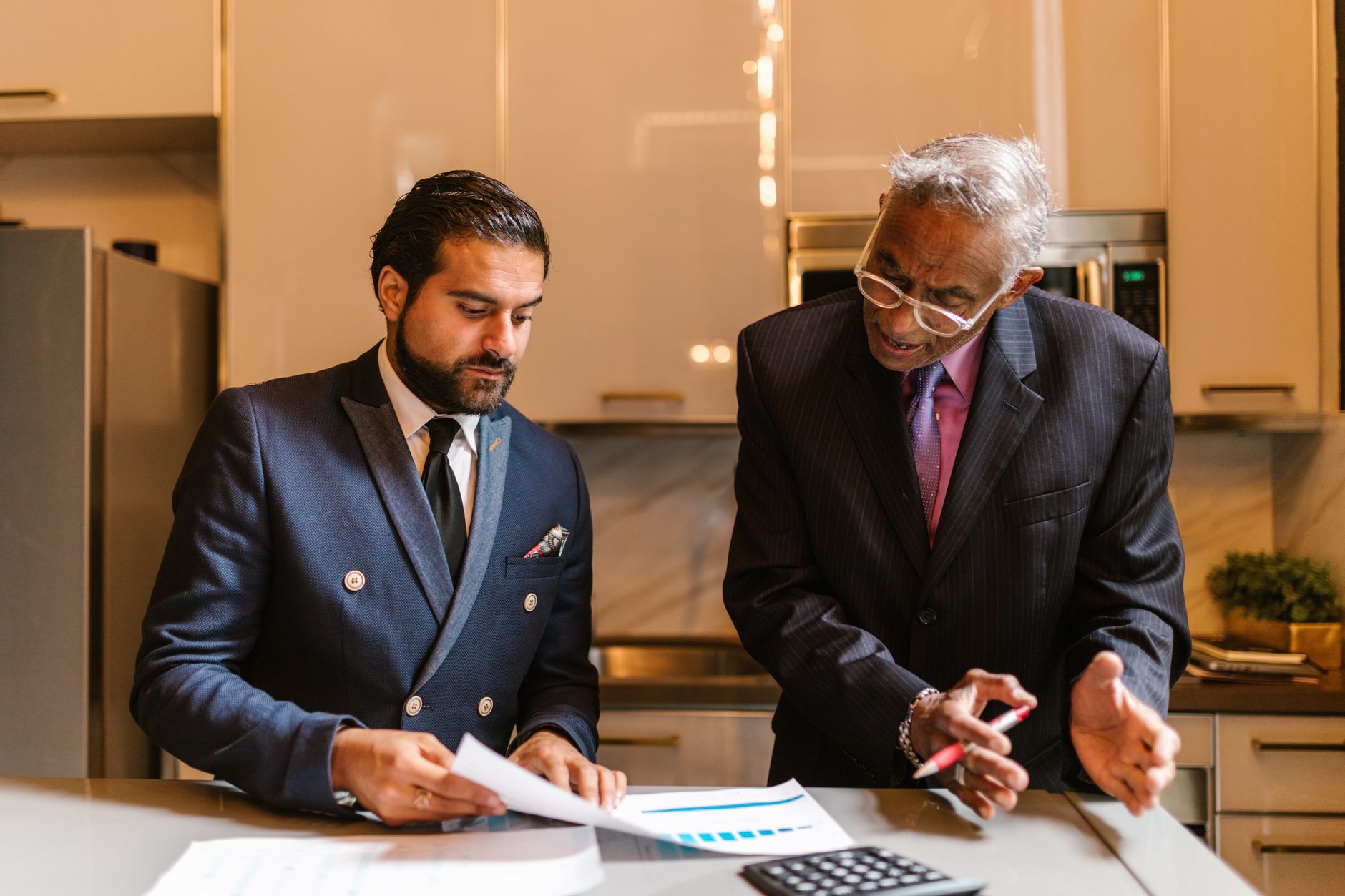 Financial advisor reviewing investment portfolio charts with a client