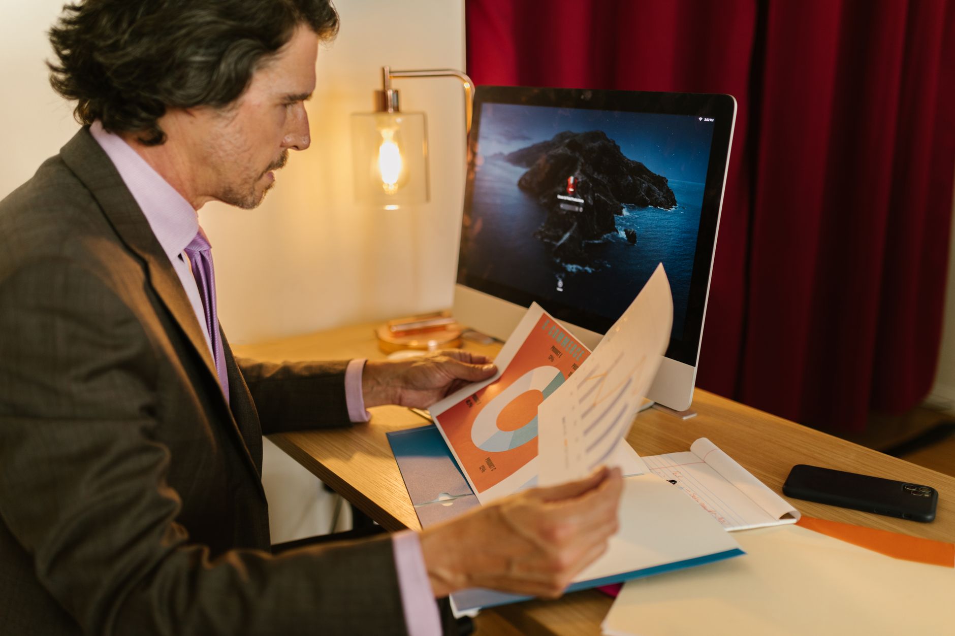 Investor reviewing financial report and portfolio data