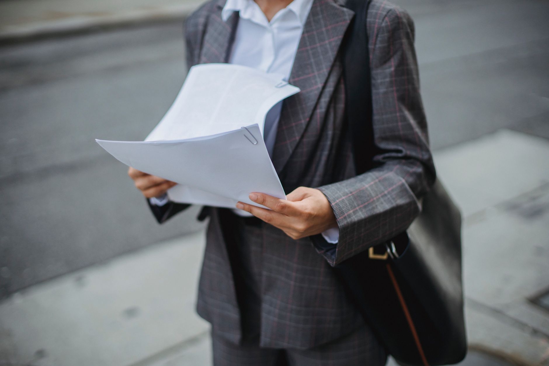 Investor reviewing financial disclosure documents at a desk