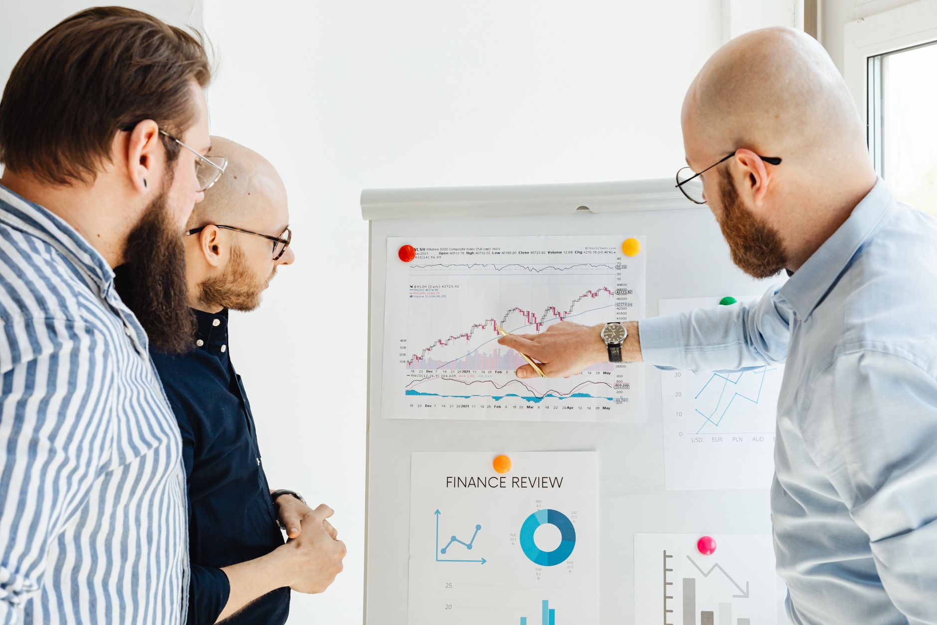 Investor reviewing a portfolio of assets on a laptop representing secondary market due diligence