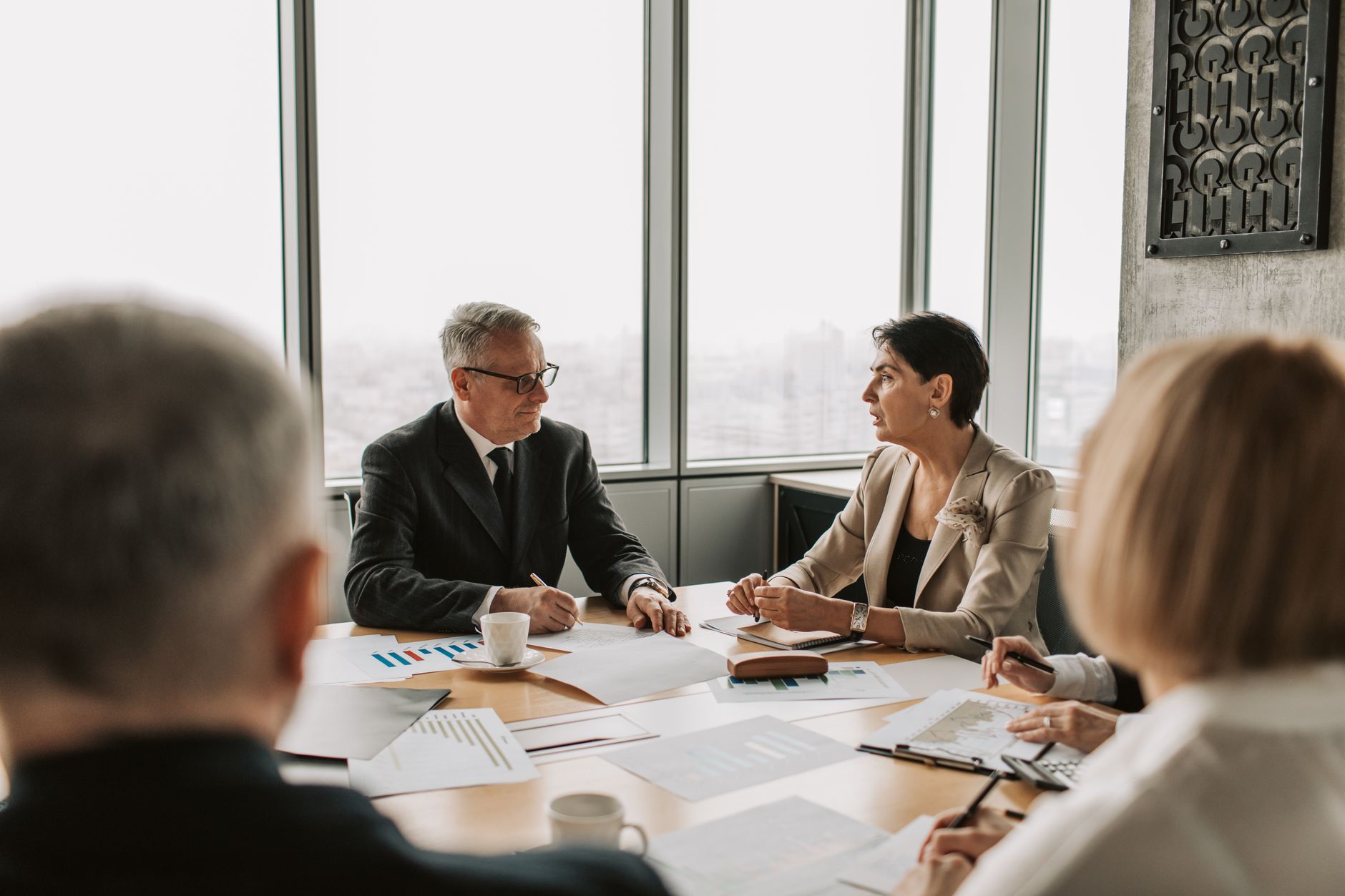 Professional investors reviewing portfolio allocation strategy in a boardroom