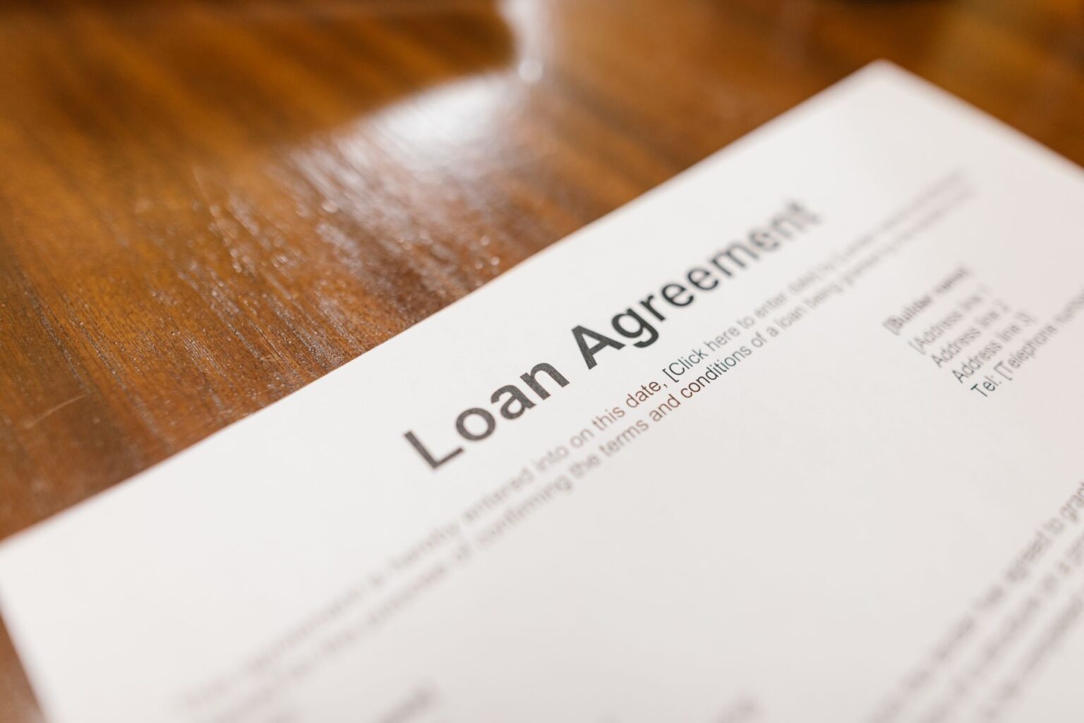 Mortgage loan documents and financial paperwork on a desk