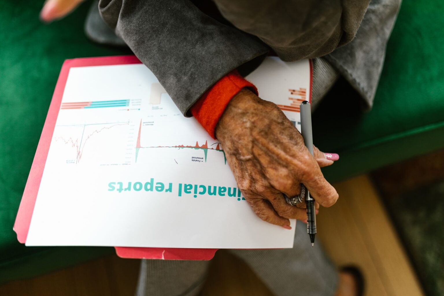 Financial documents and charts spread across a desk representing credit market analysis