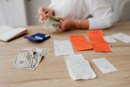 Dividend Recapitalizations Draw Scrutiny as PE Leverage Climbs Financial documents and charts representing leveraged debt transactions in private equity