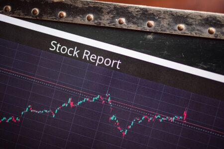 Merger Arbitrage Spreads Widen as Deal Uncertainty Lingers Financial charts showing stock price movements during a merger announcement period