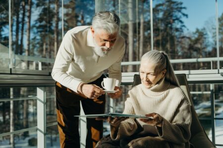 Dividend Growth ETFs Quietly Displace Bond Allocations in Retiree Portfolios A retired couple reviewing investment documents at a kitchen table