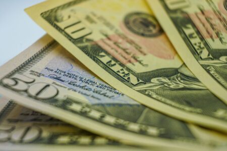 Close-up of financial documents and bond certificates representing fixed-income investing