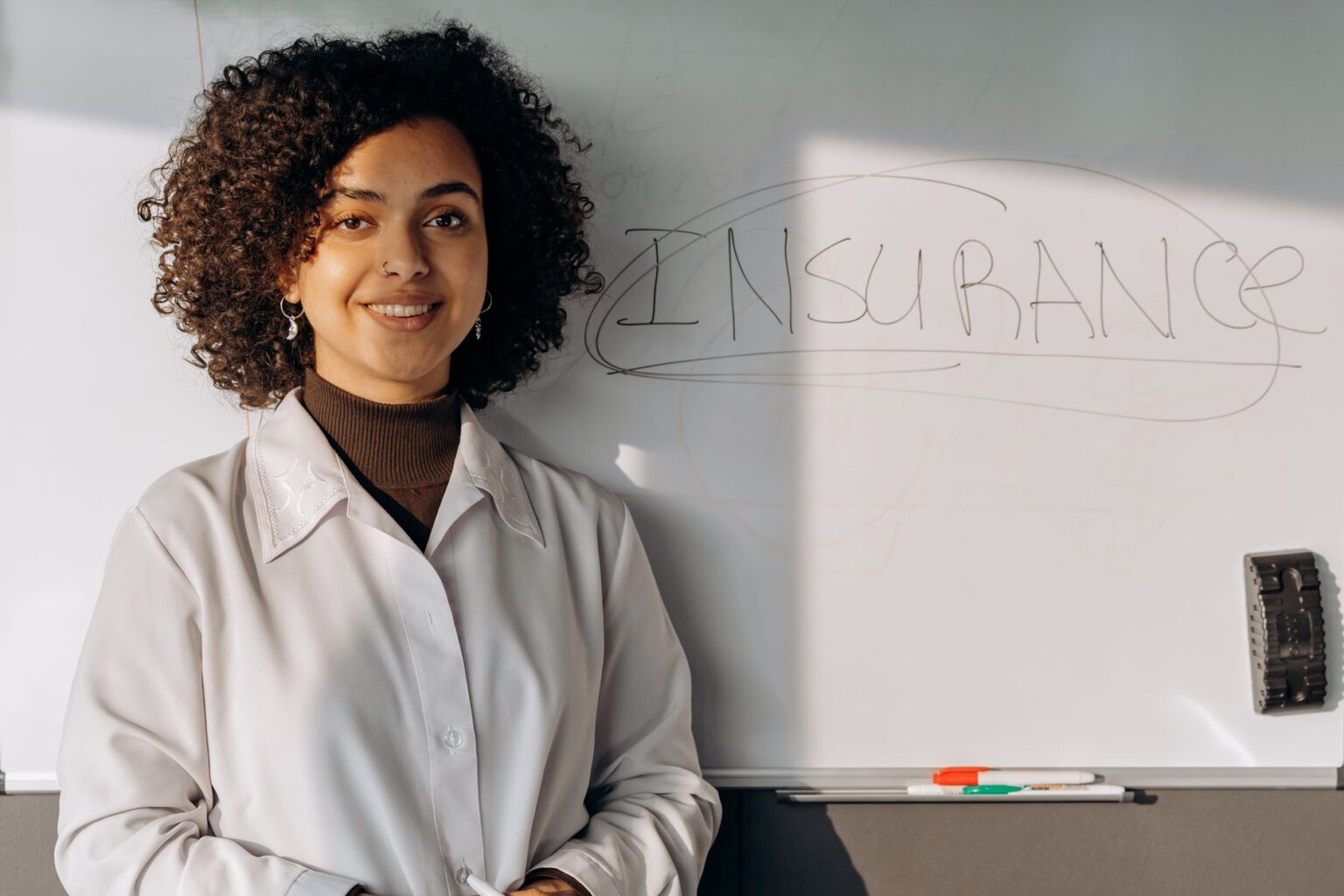 Senior Secured CLO Tranches Quietly Draw Insurance Allocators Insurance company office with professionals reviewing fixed income portfolio documents