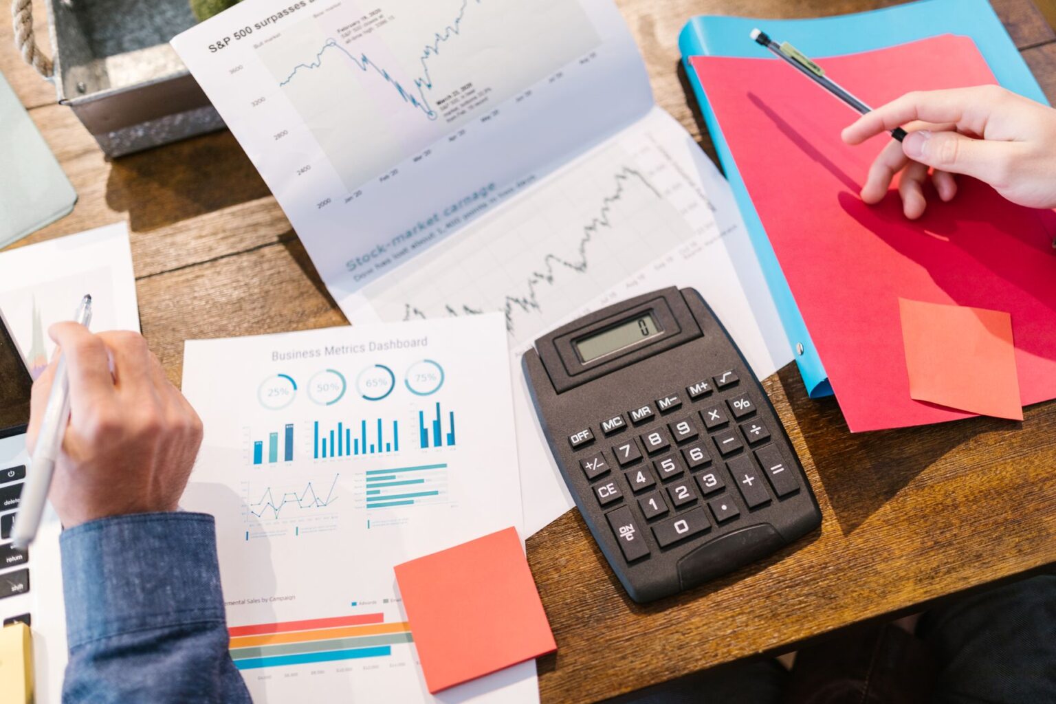 Preferred Equity in Private Credit Quietly Fills Subordinated Capital Gap Business professionals reviewing capital structure documents in a private meeting room
