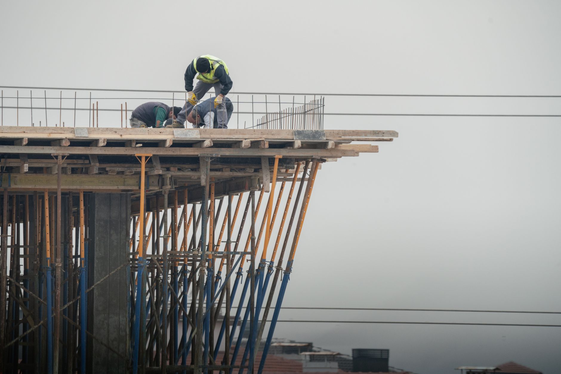 Large-scale infrastructure construction project with cranes and steel framework