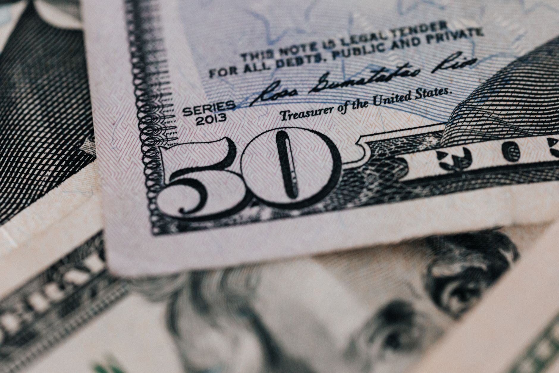 Stack of government bond certificates representing Treasury Inflation-Protected Securities
