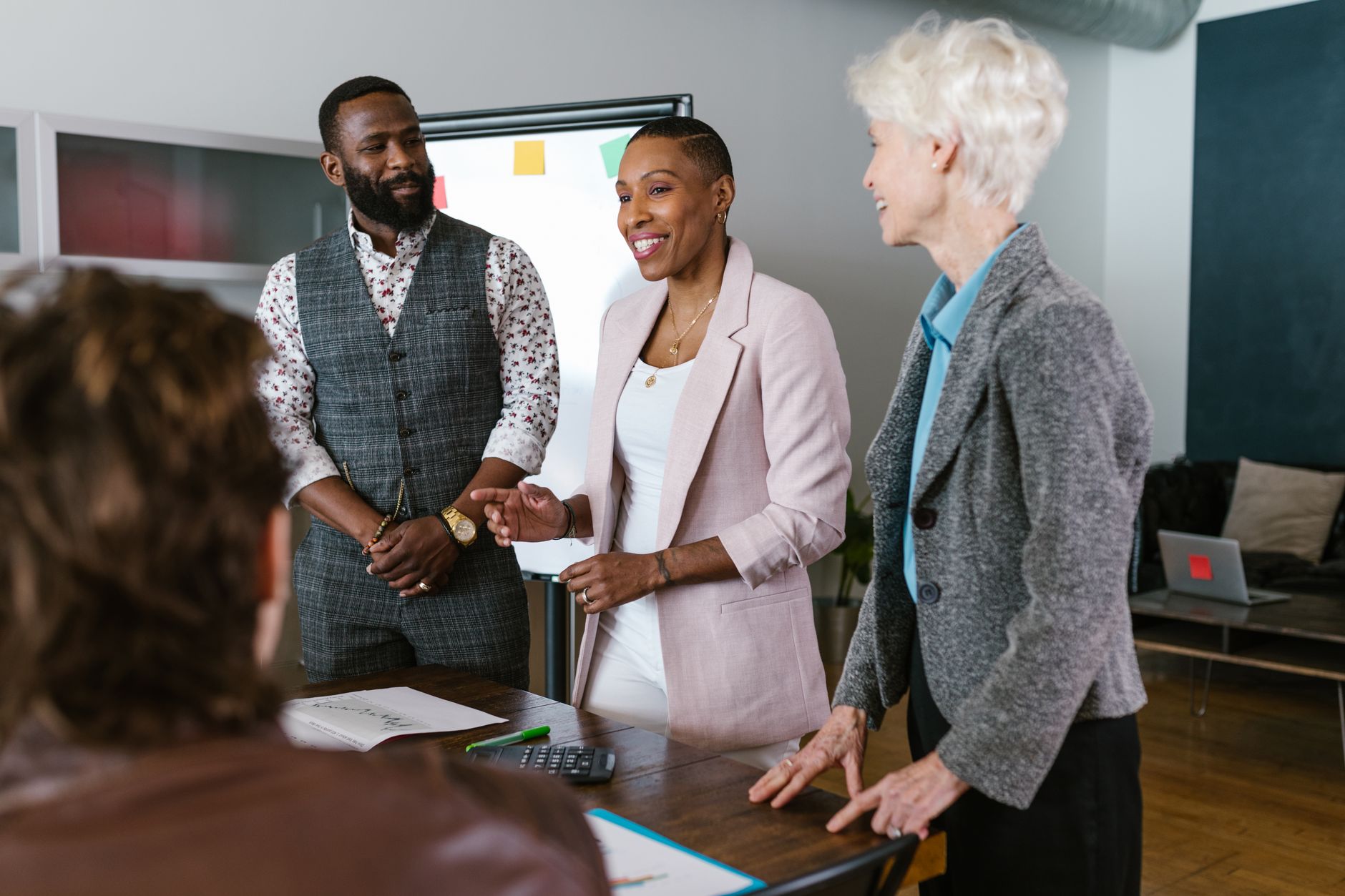 Business professionals reviewing investment documents at a conference table