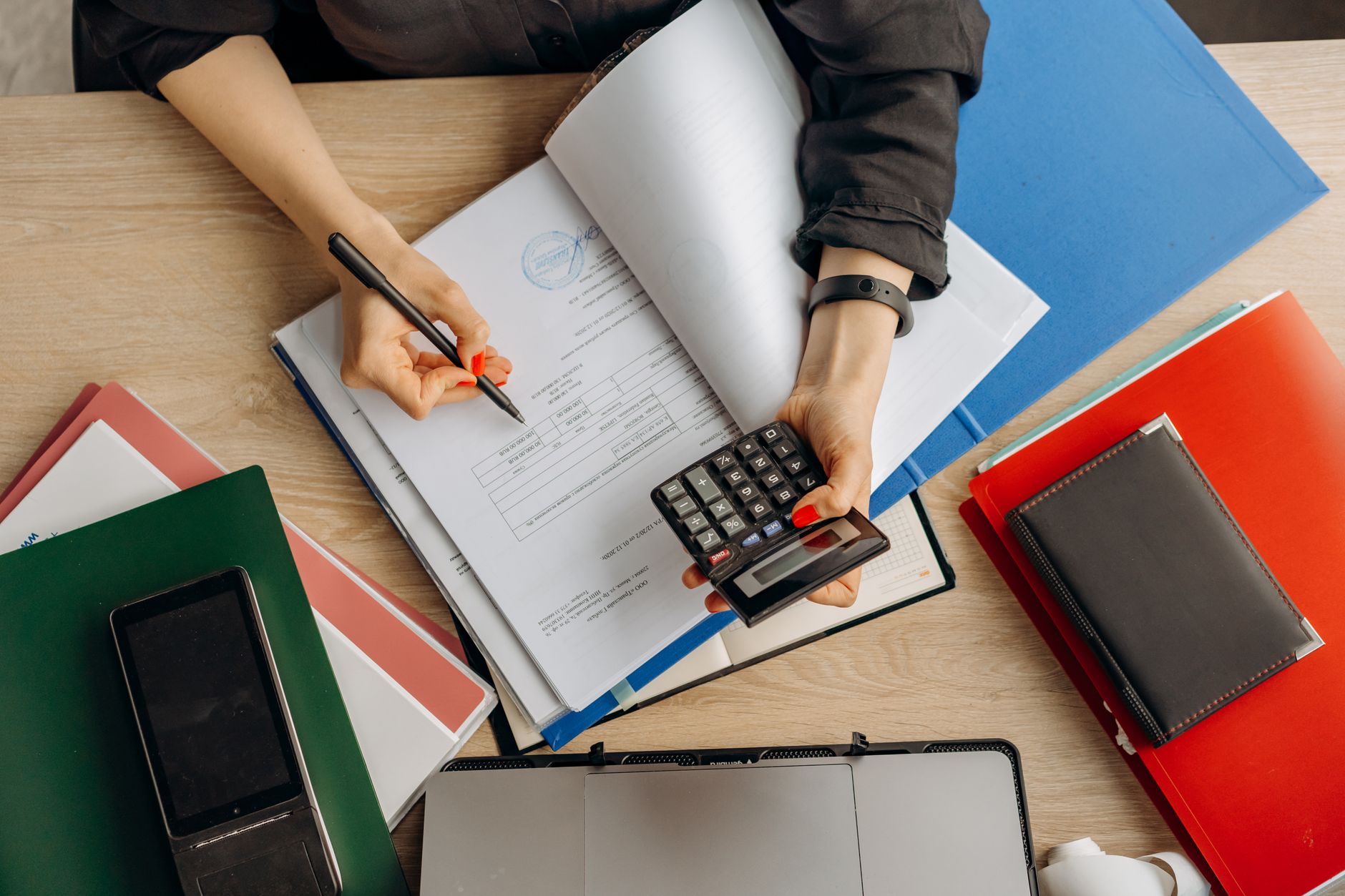 Finance professional reviewing interest rate documents at a desk